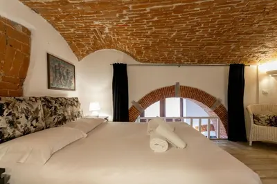 Letto o letti in una camera di Oltrarno Loft by Halldis