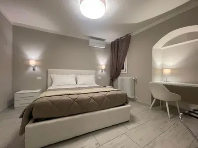 Letto o letti in una camera di Sant'Anna apartments