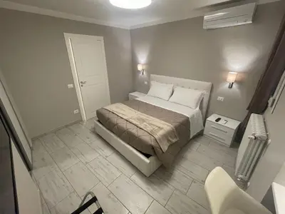 Letto o letti in una camera di Sant'Anna apartments