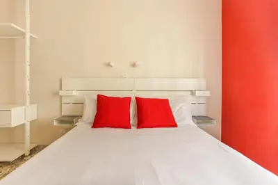 Letto o letti in una camera di The Red Loft in Ponte Vecchio