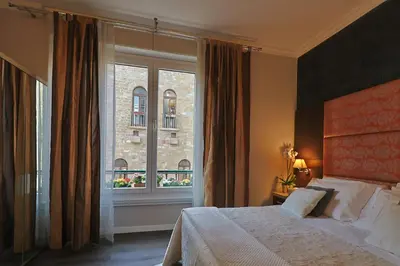 Letto o letti in una camera di Residenza Ponte Vecchio Firenze