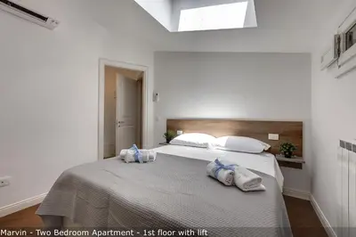 Letto o letti in una camera di Bonnie - Clyde - Marvin Apartments by Mamo Florence