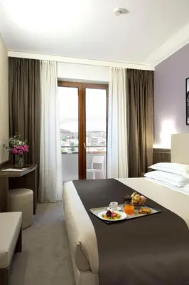 Letto o letti in una camera di Hotel Raffaello