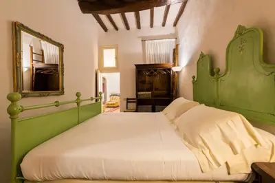 Letto o letti in una camera di Velluti by Mmega