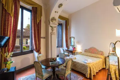 Letto o letti in una camera di Hotel Paris