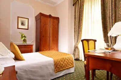 Letto o letti in una camera di Hotel Berchielli