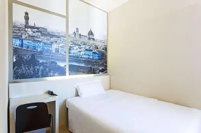 Letto o letti in una camera di B&B Hotel Firenze Novoli