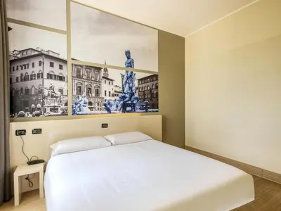 Letto o letti in una camera di B&B Hotel Firenze Novoli