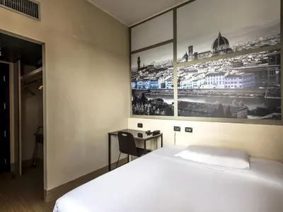 Letto o letti in una camera di B&B Hotel Firenze Novoli