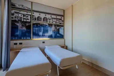 Letto o letti in una camera di B&B Hotel Firenze Novoli