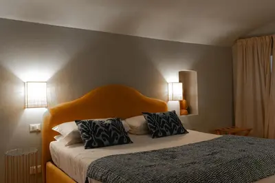 Letto o letti in una camera di Lunaria Suites - Fyodor Dostoyevsky's house