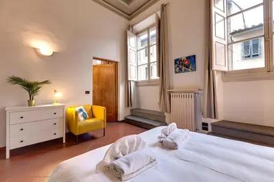 Letto o letti in una camera di Servi Apartment by Mamo Florence