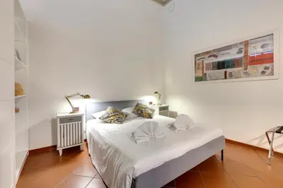 Letto o letti in una camera di Servi Apartment by Mamo Florence