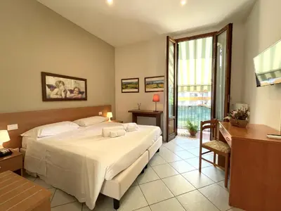Letto o letti in una camera di Hotel Leopolda