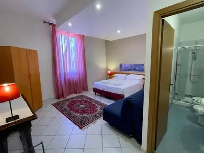 Letto o letti in una camera di Hotel Leopolda