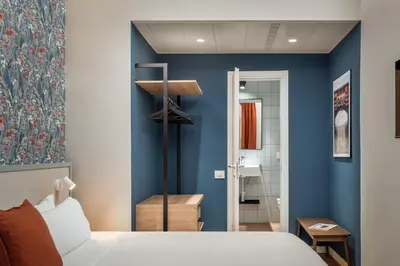 Letto o letti in una camera di BYPILLOW Goldoni
