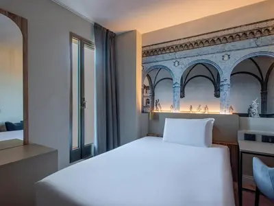 Letto o letti in una camera di B&B Hotel Firenze City Center