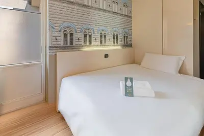 Letto o letti in una camera di B&B Hotel Firenze City Center