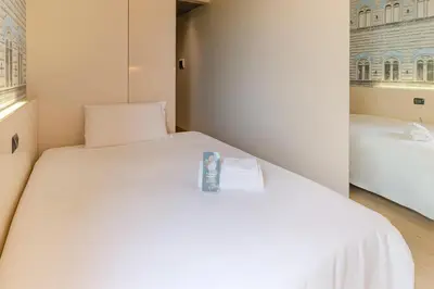 Letto o letti in una camera di B&B Hotel Firenze City Center