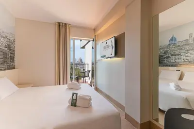 Letto o letti in una camera di B&B Hotel Firenze City Center