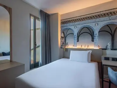 Letto o letti in una camera di B&B Hotel Firenze City Center
