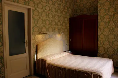 Letto o letti in una camera di Hotel Beatrice