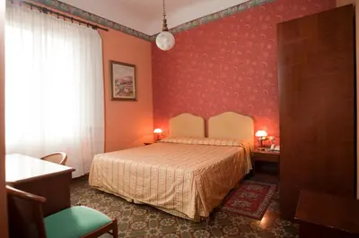 Letto o letti in una camera di Hotel Beatrice