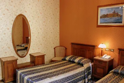 Letto o letti in una camera di Hotel Beatrice
