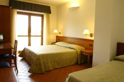 Letto o letti in una camera di Hotel Villa Dei Bosconi