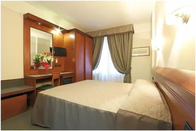 Letto o letti in una camera di Hotel Arcadia