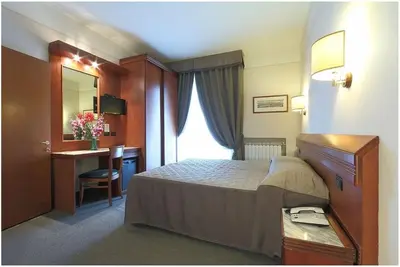 Letto o letti in una camera di Hotel Arcadia