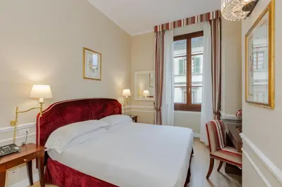 Letto o letti in una camera di FH55 Hotel Calzaiuoli
