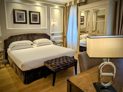 Letto o letti in una camera di FH55 Hotel Calzaiuoli