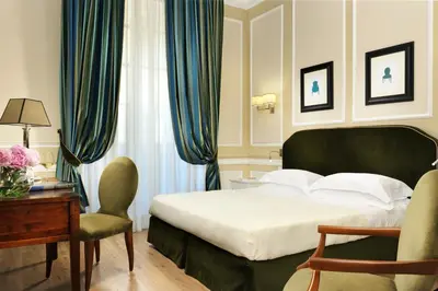 Letto o letti in una camera di FH55 Hotel Calzaiuoli