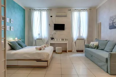 TV o dispositivi per l'intrattenimento presso Charlize Apartment by Mamo Florence