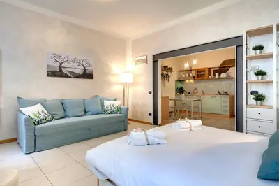 Letto o letti in una camera di Charlize Apartment by Mamo Florence