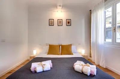 Letto o letti in una camera di Aida Apartment by Mamo Florence