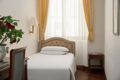 Letto o letti in una camera di Hotel Boccaccio