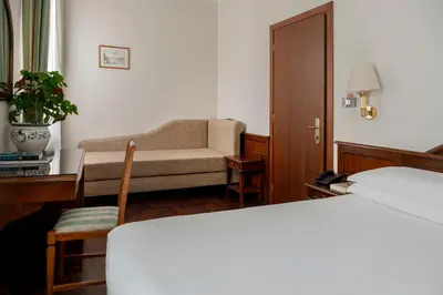 Letto o letti in una camera di Hotel Boccaccio