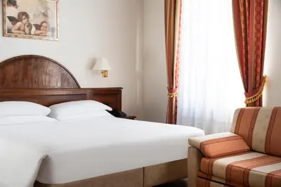 Letto o letti in una camera di Hotel Boccaccio