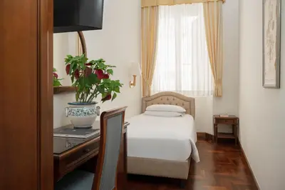 Letto o letti in una camera di Hotel Boccaccio