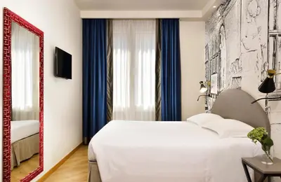 Letto o letti in una camera di FH55 Grand Hotel Mediterraneo