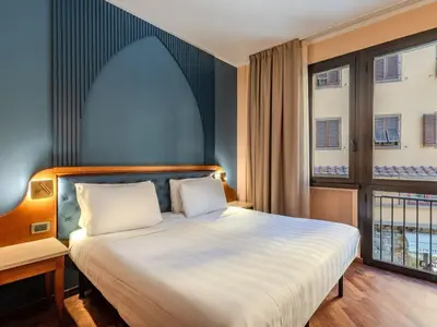 Letto o letti in una camera di B&B Hotel Firenze Pitti Palace al Ponte Vecchio