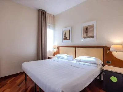 Letto o letti in una camera di B&B Hotel Firenze Pitti Palace al Ponte Vecchio