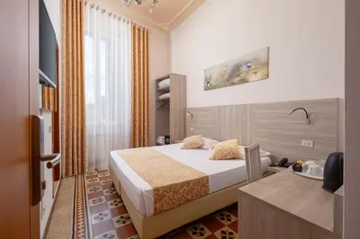 Letto o letti in una camera di Lilium Hotel