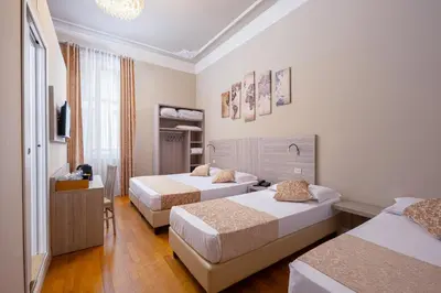 Letto o letti in una camera di Lilium Hotel