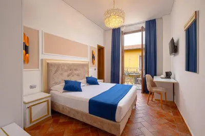 Letto o letti in una camera di Hotel Annabella Roof Terrace
