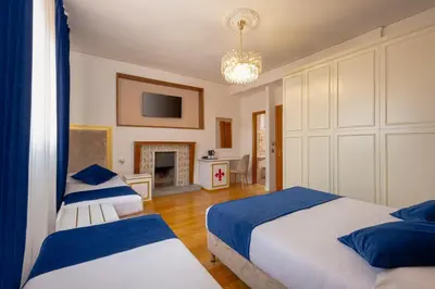 Letto o letti in una camera di Hotel Annabella Roof Terrace