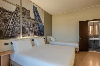 Letto o letti in una camera di B&B Hotel Firenze Nuovo Palazzo Di Giustizia