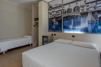 Letto o letti in una camera di B&B Hotel Firenze Nuovo Palazzo Di Giustizia
